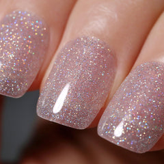 Vernis gel Ozzeal avec paillettes clair argent irisée pour une manucure lumineuse.