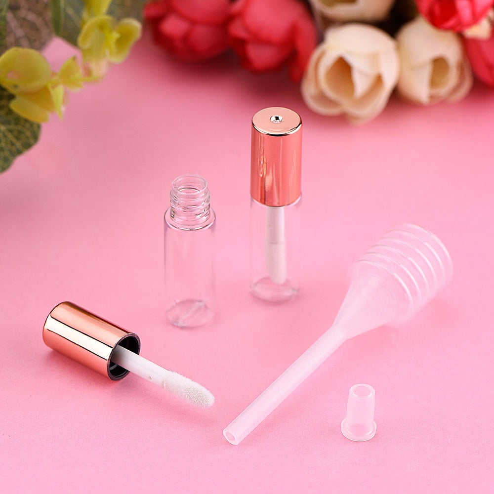 Pangda bouteille gloss transparente avec capuchon rose doré, utile lors d'un maquillage rapide.
