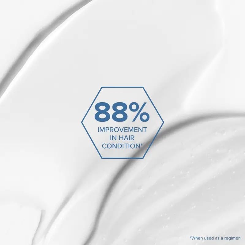 Application du masque Bond Rx sur les cheveux, soin ciblé.
