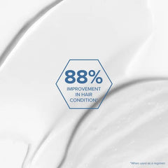 Application du masque Bond Rx sur les cheveux, soin ciblé.