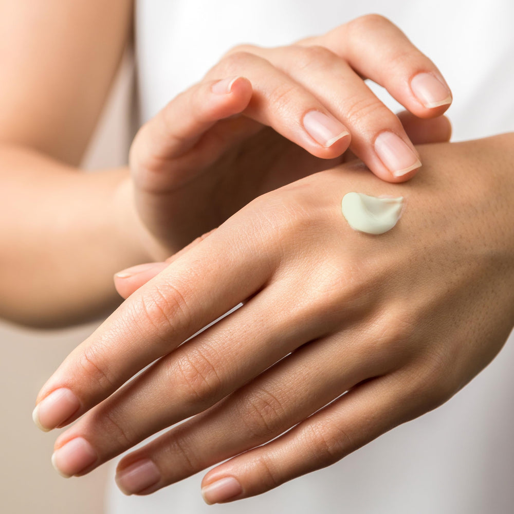 Applying Pureonica cream to skin shows soothing hydration.
