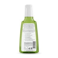 RAUSCH Shampoing aux herbes suisses, bouteille reflet, aspect frais et net.