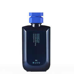 Bouteille R+Co BLEU Essential Shampoing prête à hydrater et protéger les cheveux.