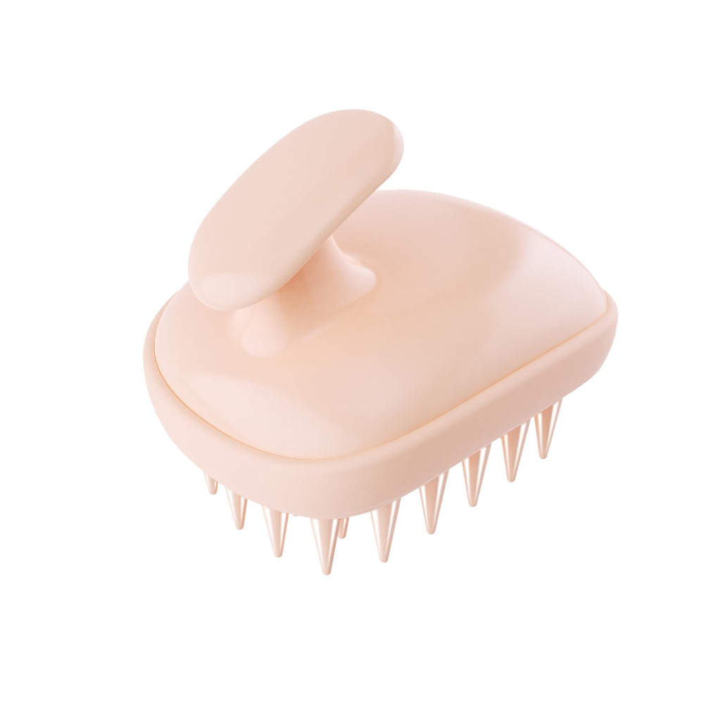 Brosse Rebex avec brins silicone doux pour exfolier et détendre le cuir chevelu.