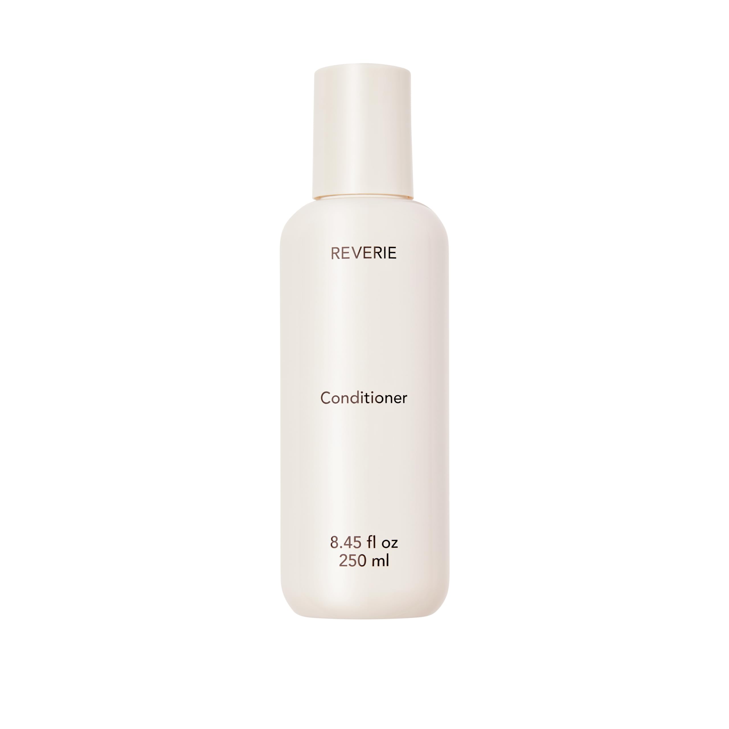 REVERIE après-shampoing nourrissant en flacon, hydratation légère pour tous les cheveux.