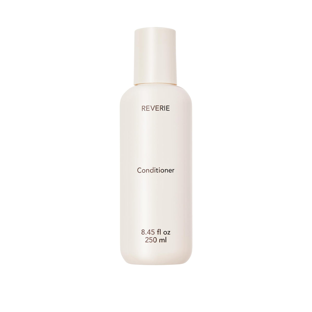 REVERIE après-shampoing nourrissant en flacon, hydratation légère pour tous les cheveux.