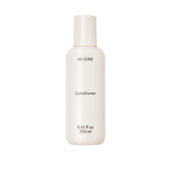 REVERIE après-shampoing nourrissant en flacon, hydratation légère pour tous les cheveux.