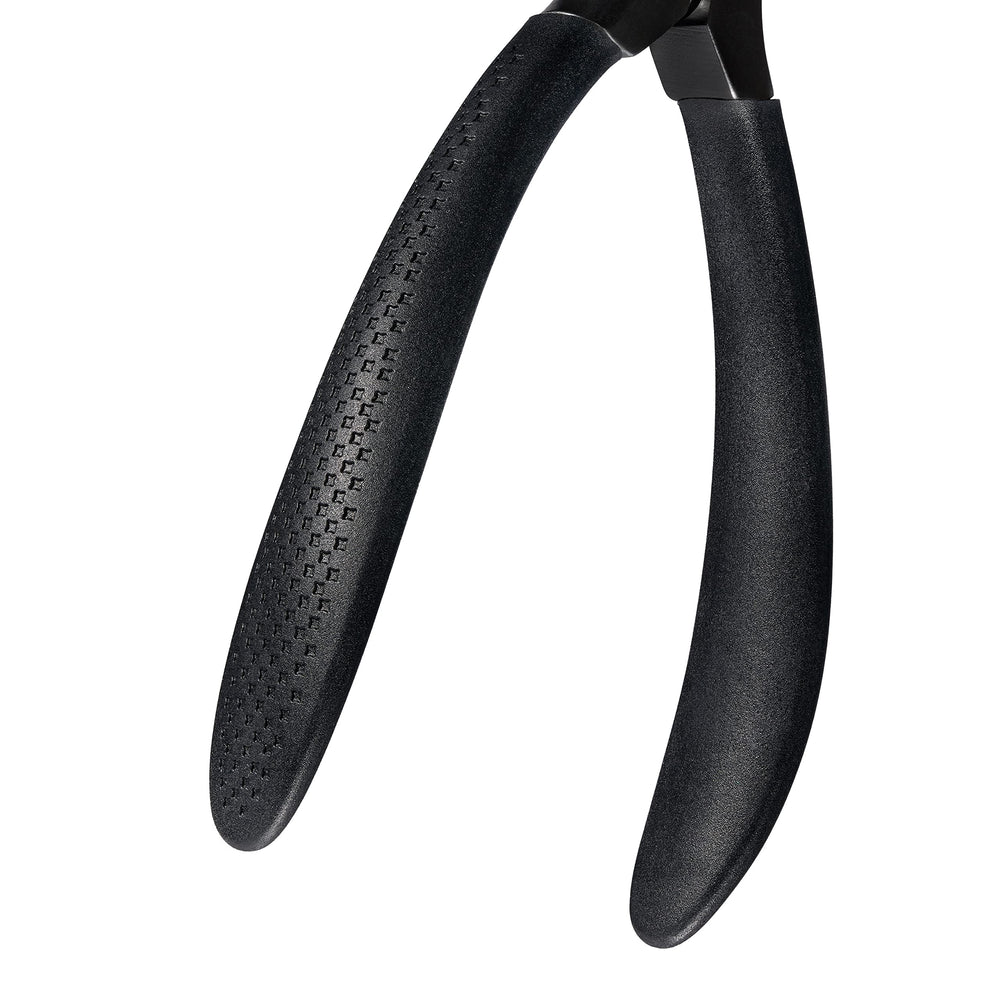 REVLON Comfort et Contrôle ressort léger facilitant le mouvement des lames.
