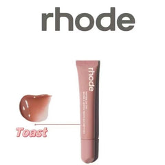 Rhode Gloss Lip Tint teinte rosée Toast offre un éclat subtil et hydratant.