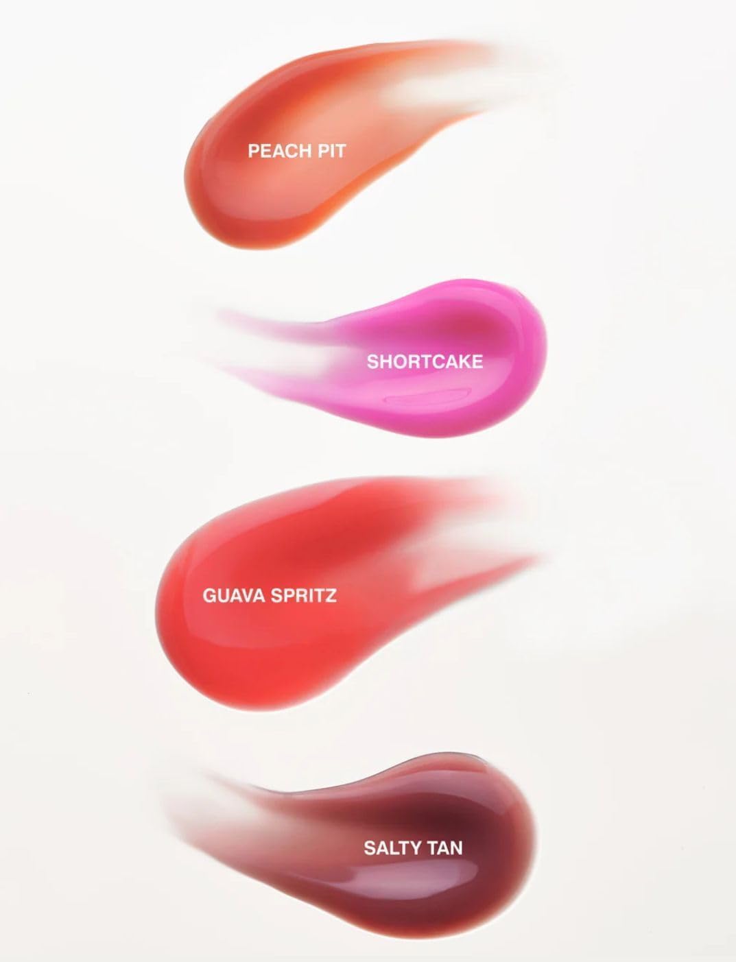 Rhode Gloss Lip Tint fini satiné Toast donne un sourire lumineux.