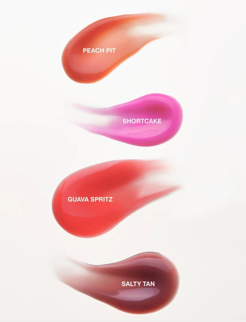 Rhode Gloss Lip Tint fini satiné Toast donne un sourire lumineux.