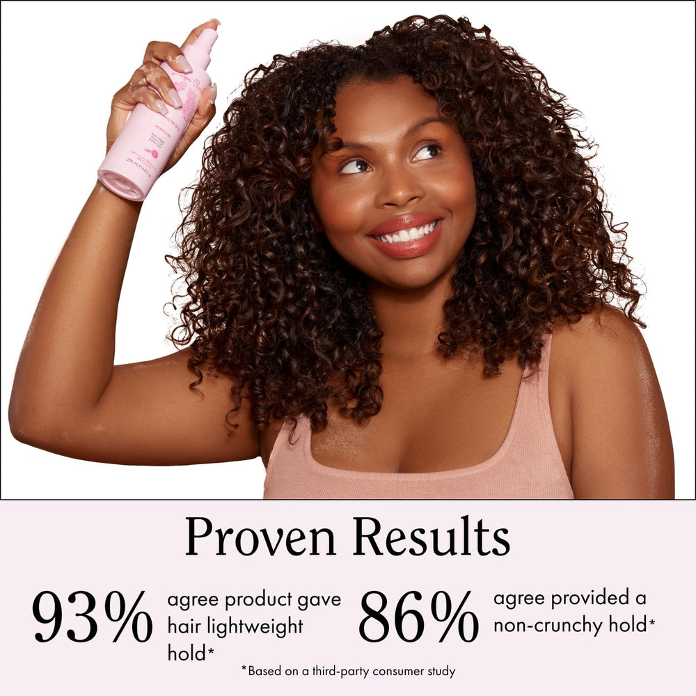 Rizos Curls spray leaving hair with defined, shiny curls.