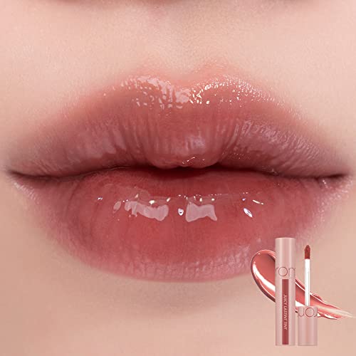 rom&nd Juicy Lasting Tint #23 Nucadamia teinte nude pour un effet naturel.
