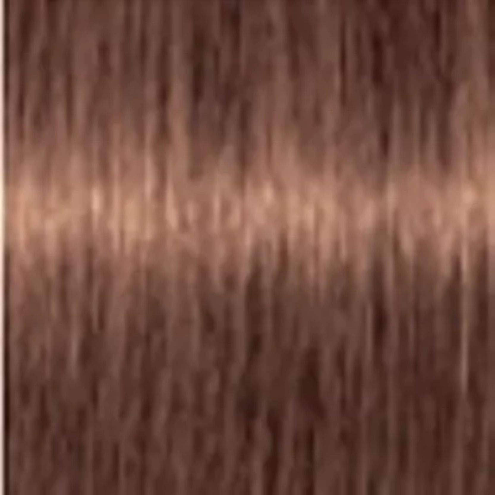Application sur cheveux avec Igora ROYAL Crème couleur 7-57, rendu précis.