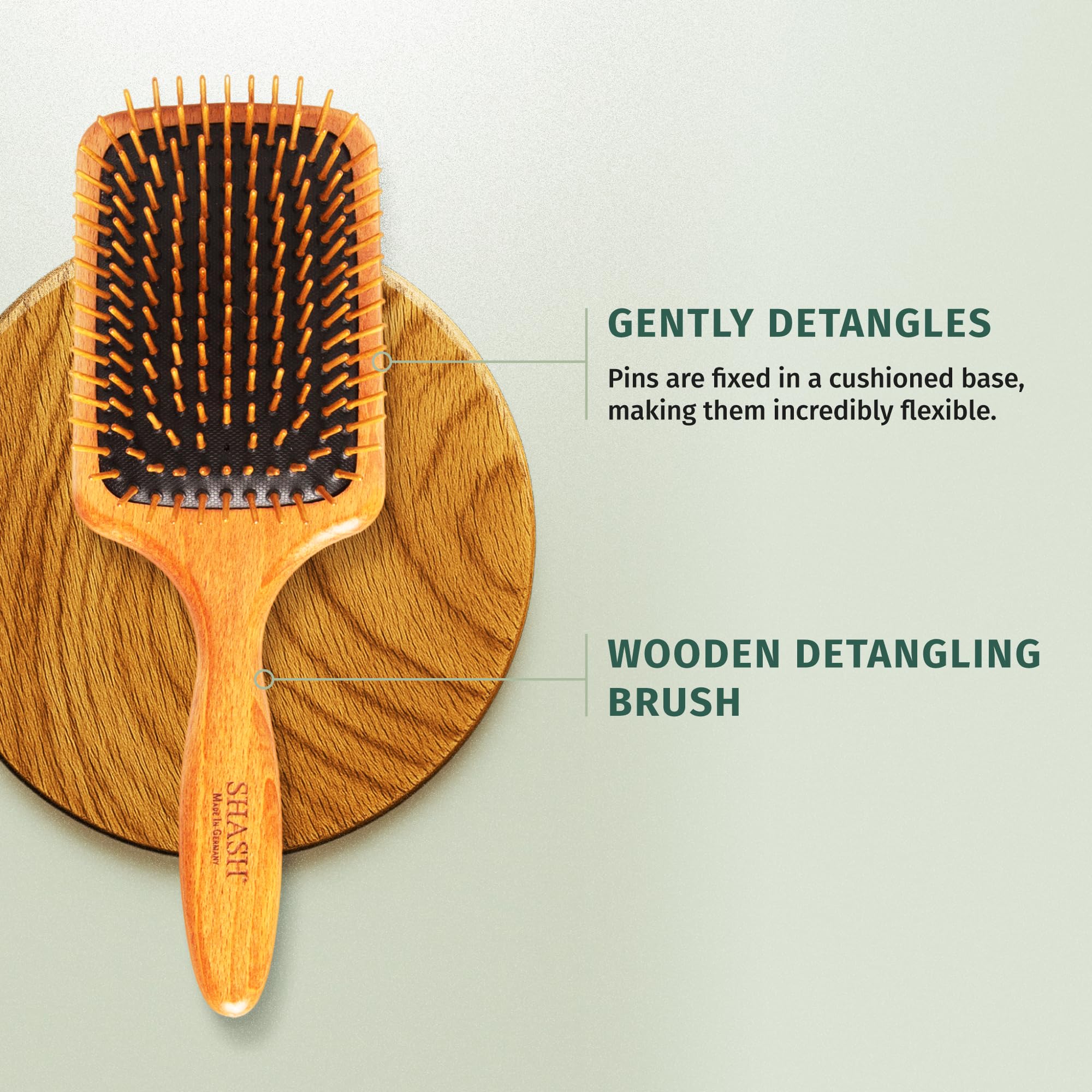 SHASH brosse paddle au design pensé réduisant les tiraillements et les nœuds.