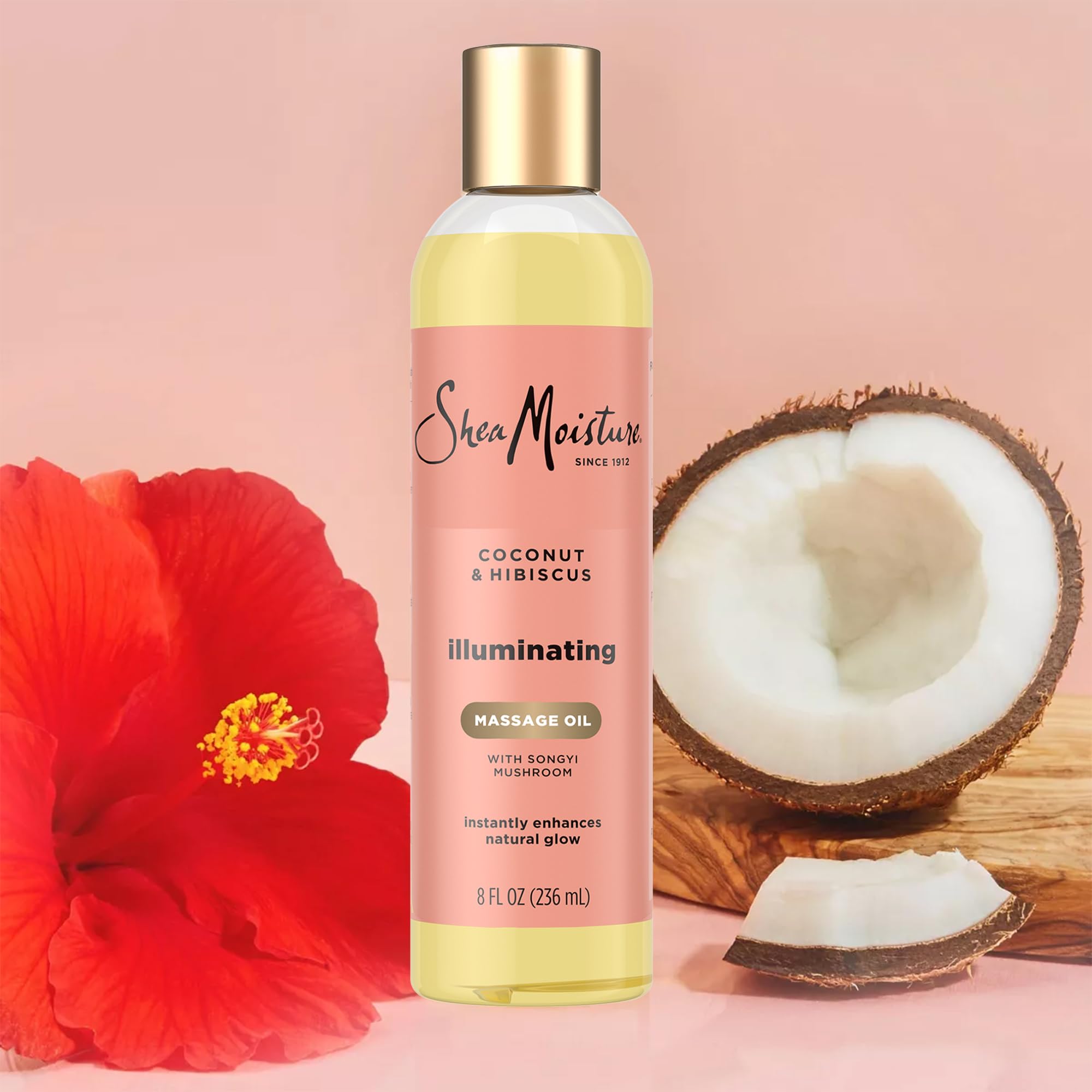 SheaMoisture huile massage illuminante, flacon parfum luxueux, expérience spa à domicile.
