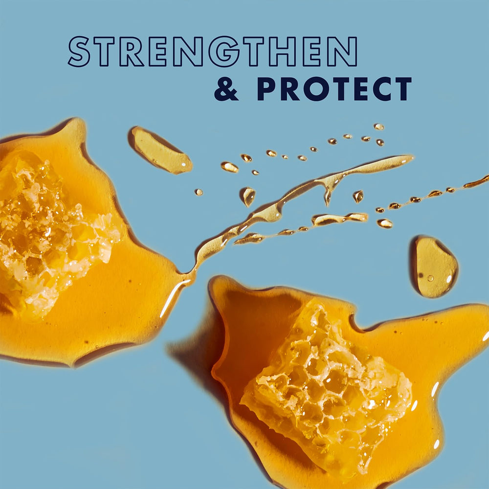 Application à la main du masque SheaMoisture Manuka Honey et Yaourt sur cheveux