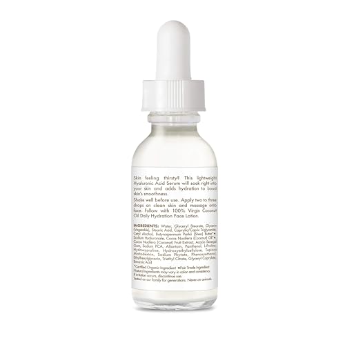 Gouttes du sérum SheaMoisture appliquées sur peau pour une absorption rapide.