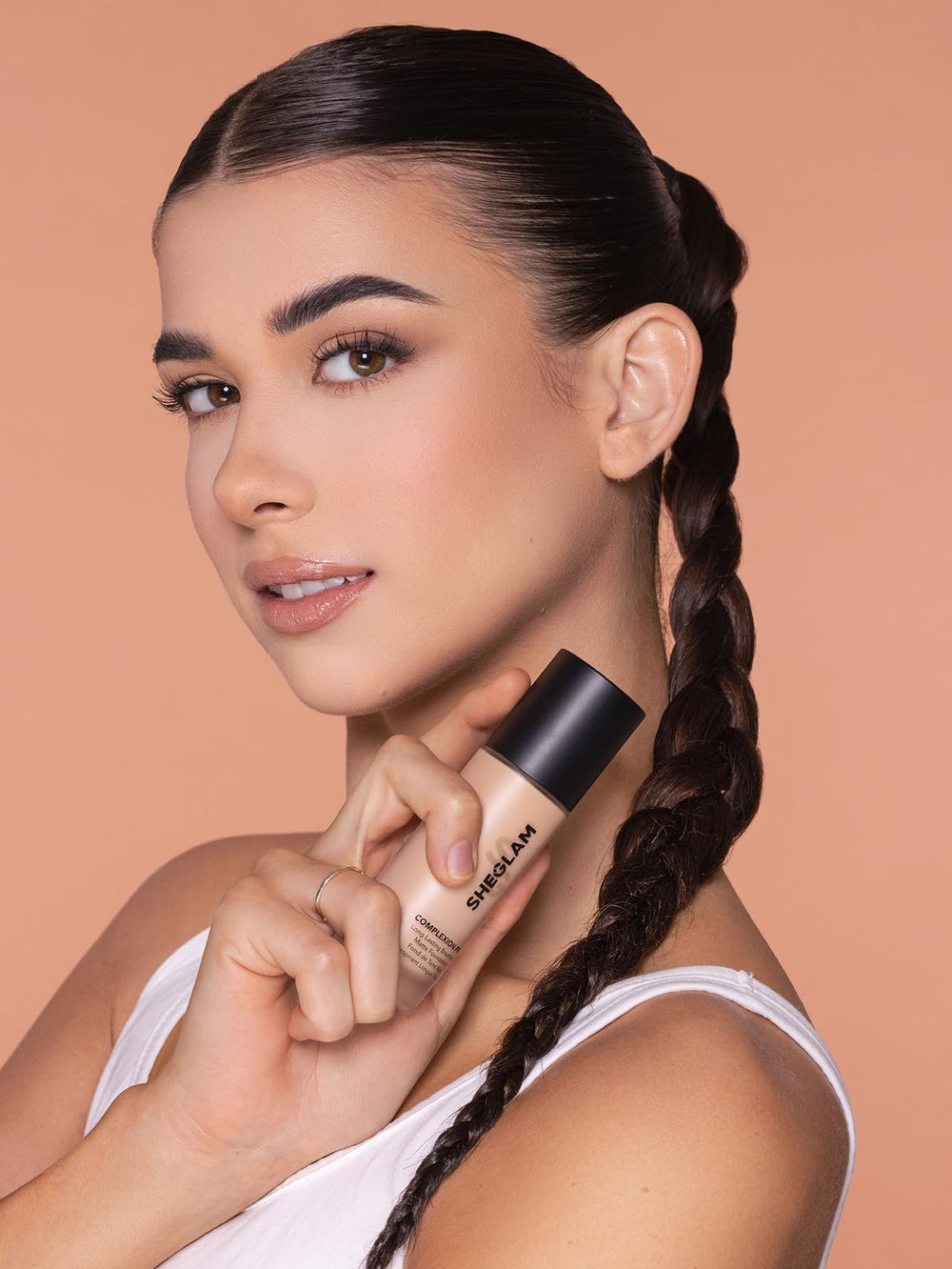 SHEGLAM sponge blending foundation for flawless, streak-free finish.