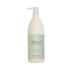 SHIBUI Shampoing Ultra Hydratant bouteille ouverte, hydratation légère pour cheveux texturés.