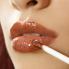 Shop Stunner Shades Stunn Shine – effet holographique subtil sur les lèvres.