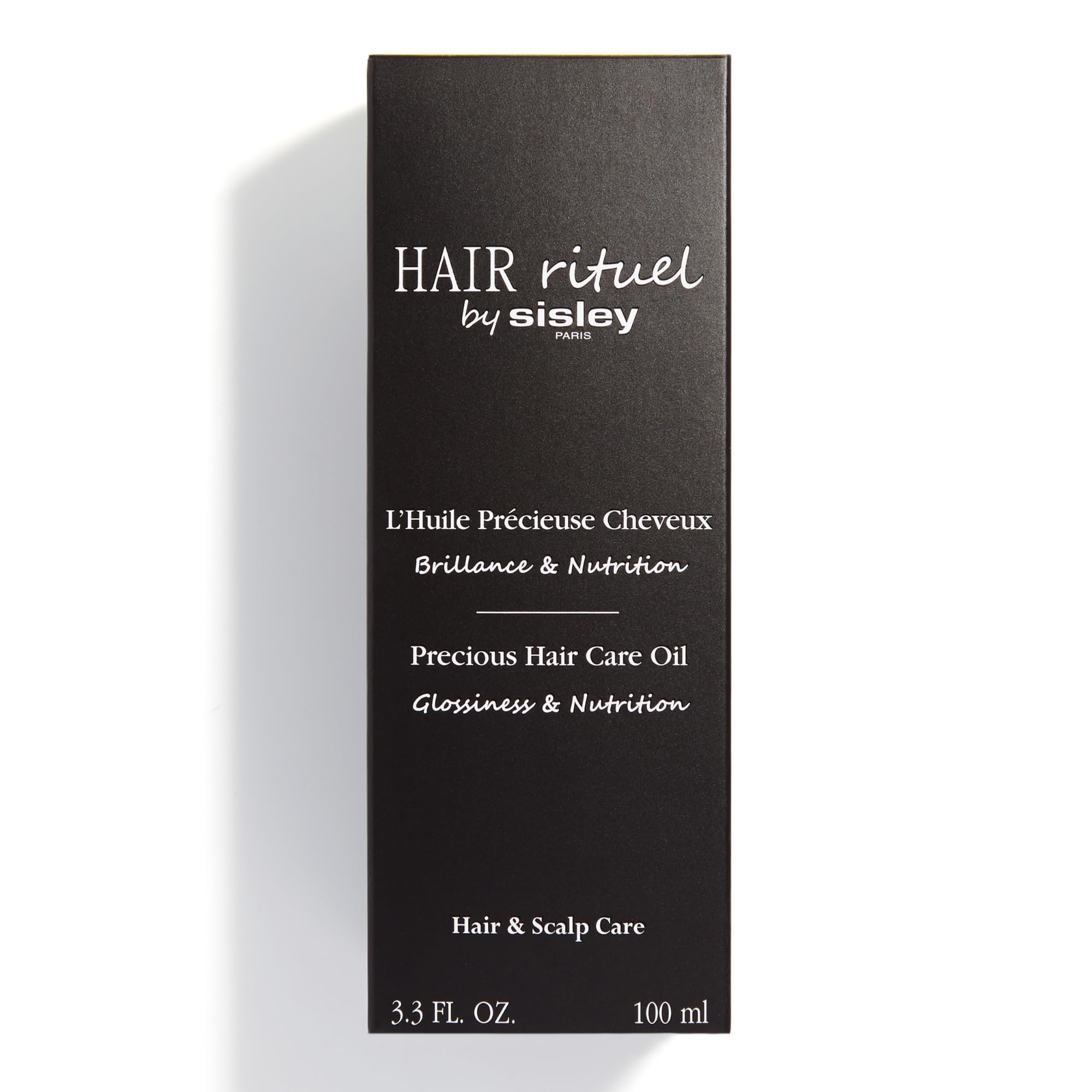 Hair Rituel par Sisley – huile nourrissante à base d huiles de moringa et coton pour les longueurs.