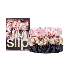 SLIP scrunchie large en soie rose, texture satinée qui glisse sans accrocher.