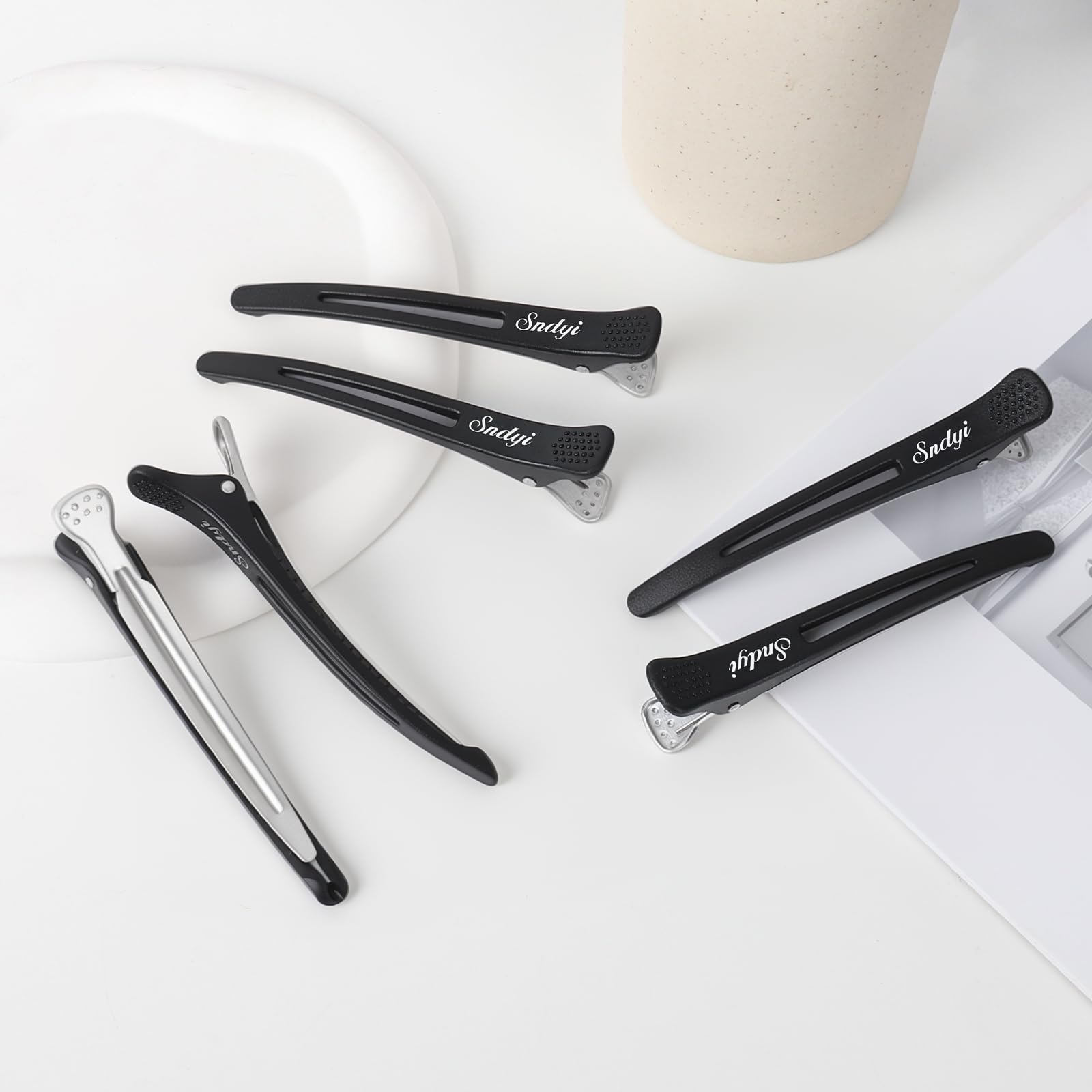Pinces Sndyi coiffure maison et salon noir, résistantes et polyvalentes.