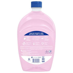 Softsoap refill bottle on the counter signals easy refilling for daily use.