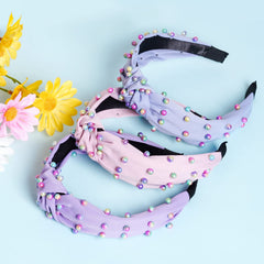 Bandeau Sucrain avec noeud croise, design tendance et maintien sûr.