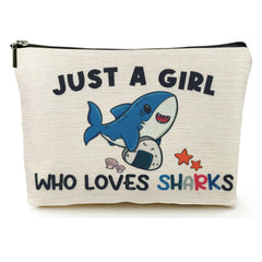 Sac maquillage Suemetic au motif requin, parfait pour transporter vos essentiels.