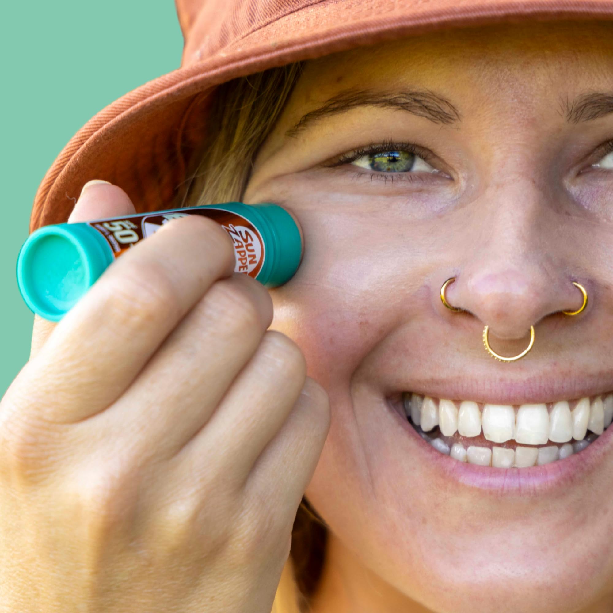 Sun Zapper bâton zinc extrême teinte bronze, idéal pour natation et aventures.