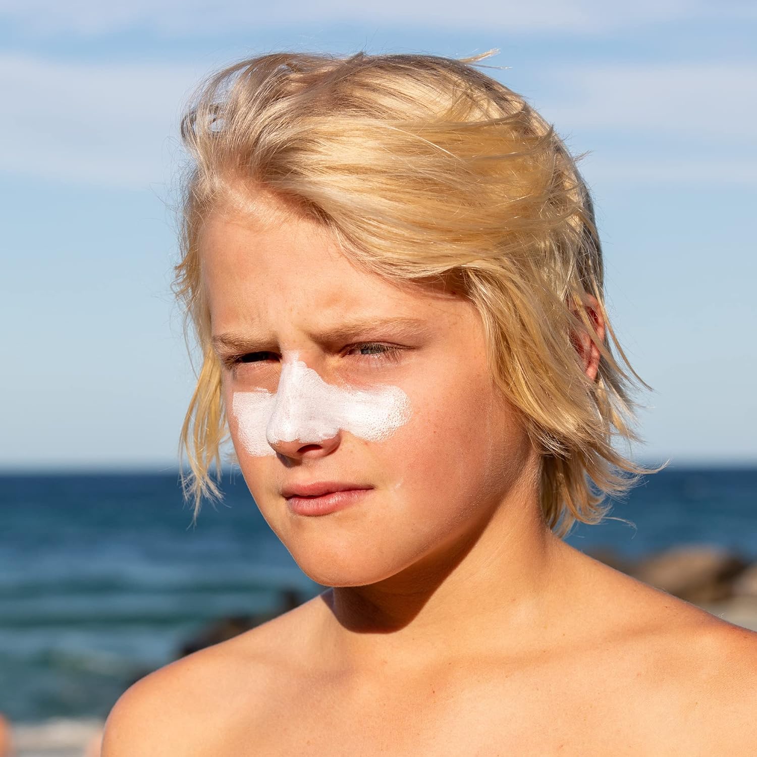 Sun Zapper sunscreen stick demonstrates water-resistant action near water
