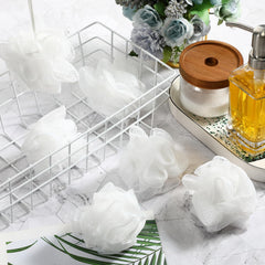 Loofah Suttmin, texture exfoliante légère et mousse riche.