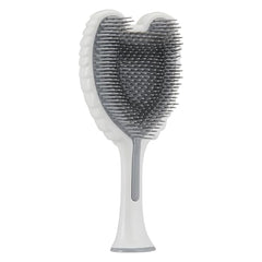 Prise en main ergonomique de la brosse Tangle Angel pour le brossage.