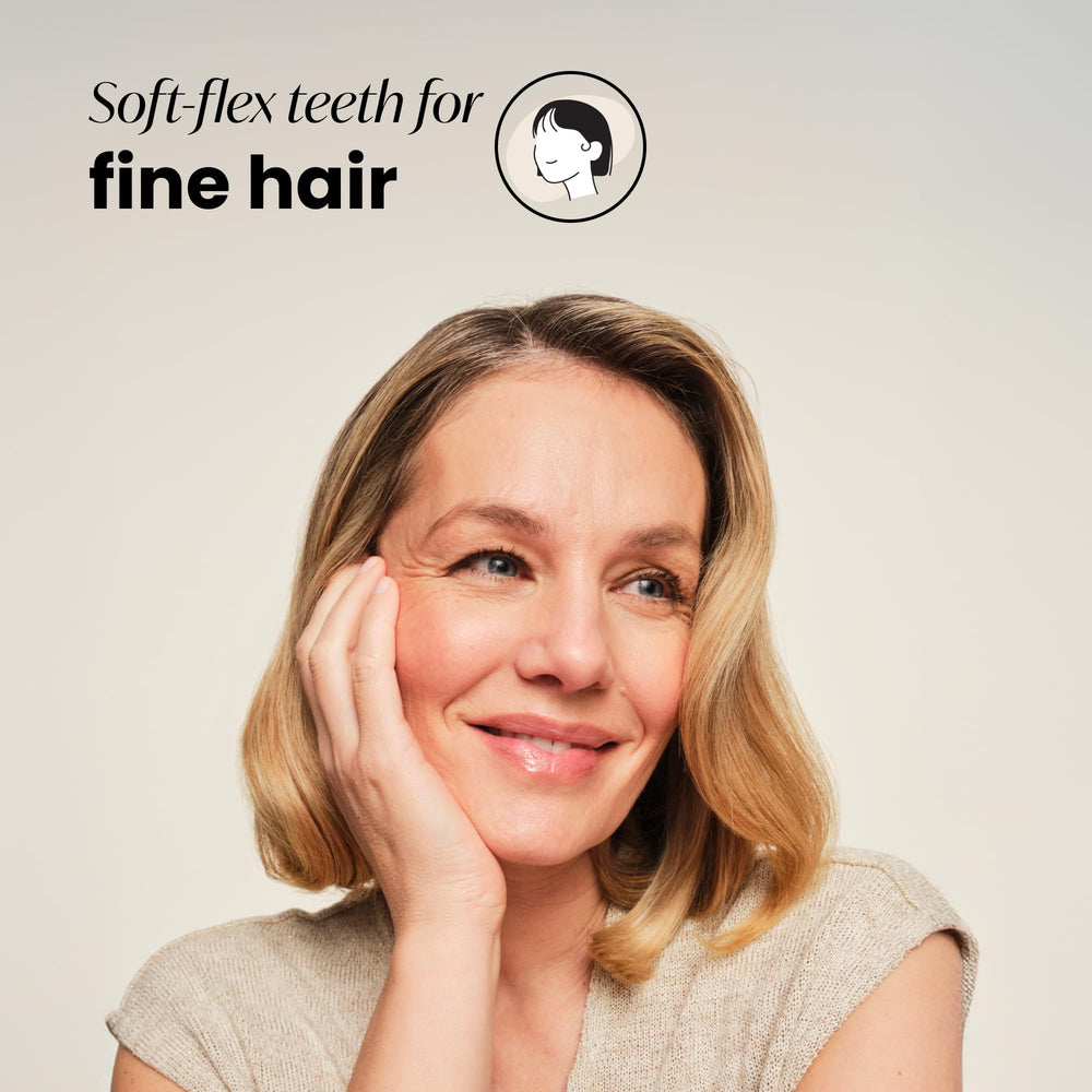 Brosse Tangle Teezer Original Detangler, design palm pour une prise en main confortable.