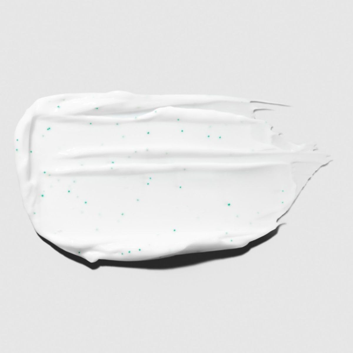 Texture crème hydratante Tea Tree pour cheveux doux et réparés après usage.