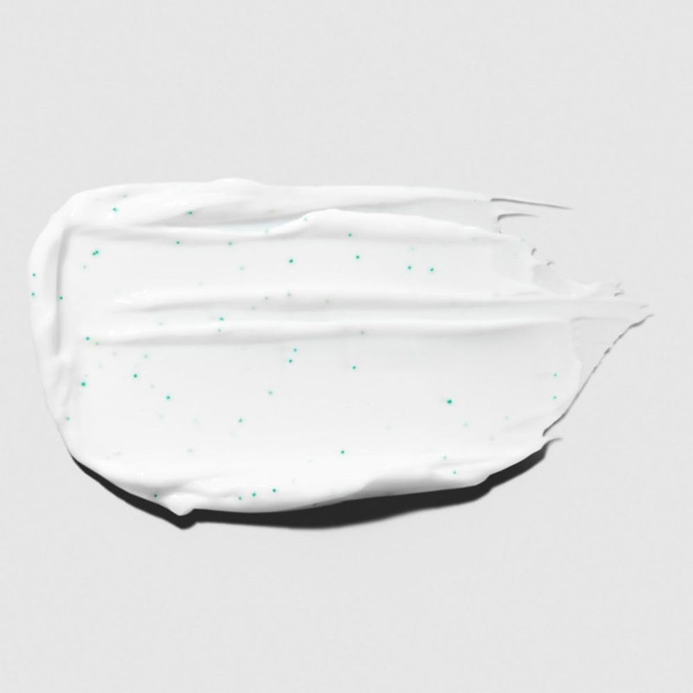 Texture crème hydratante Tea Tree pour cheveux doux et réparés après usage.