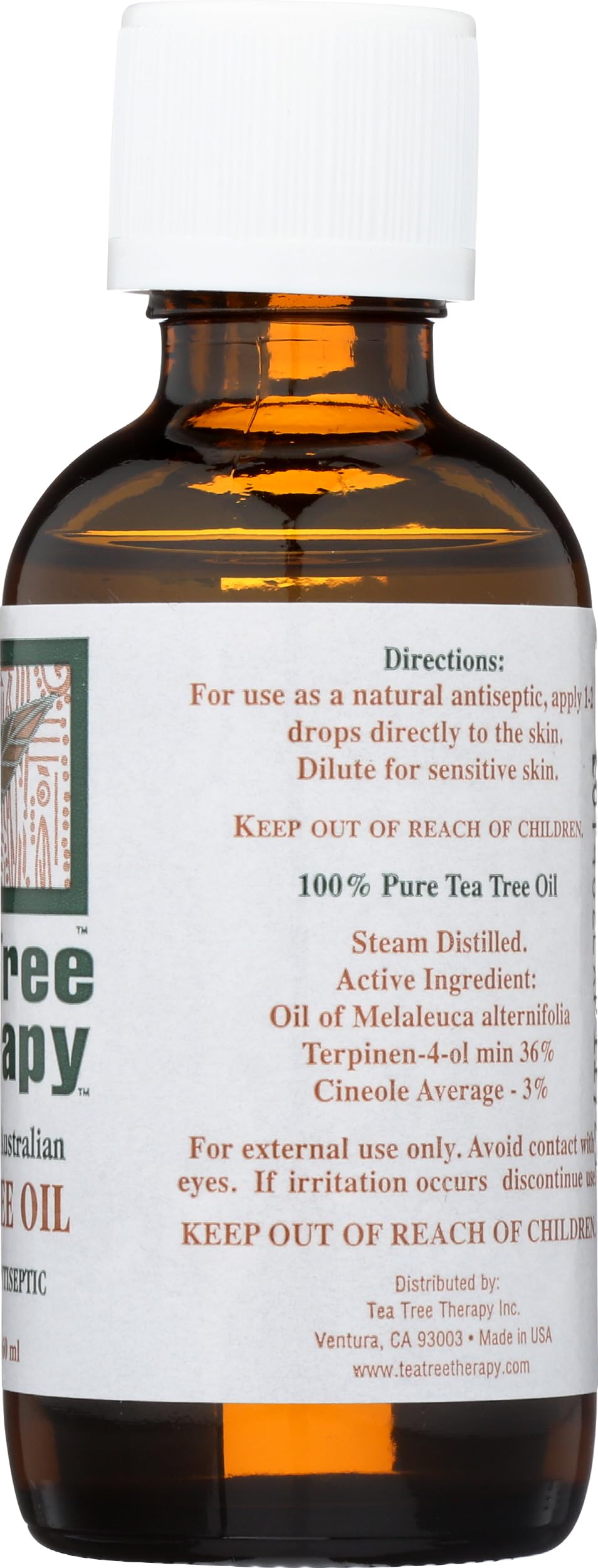 Tea Tree Therapy bottle on wooden table ready for daily self-care routines.