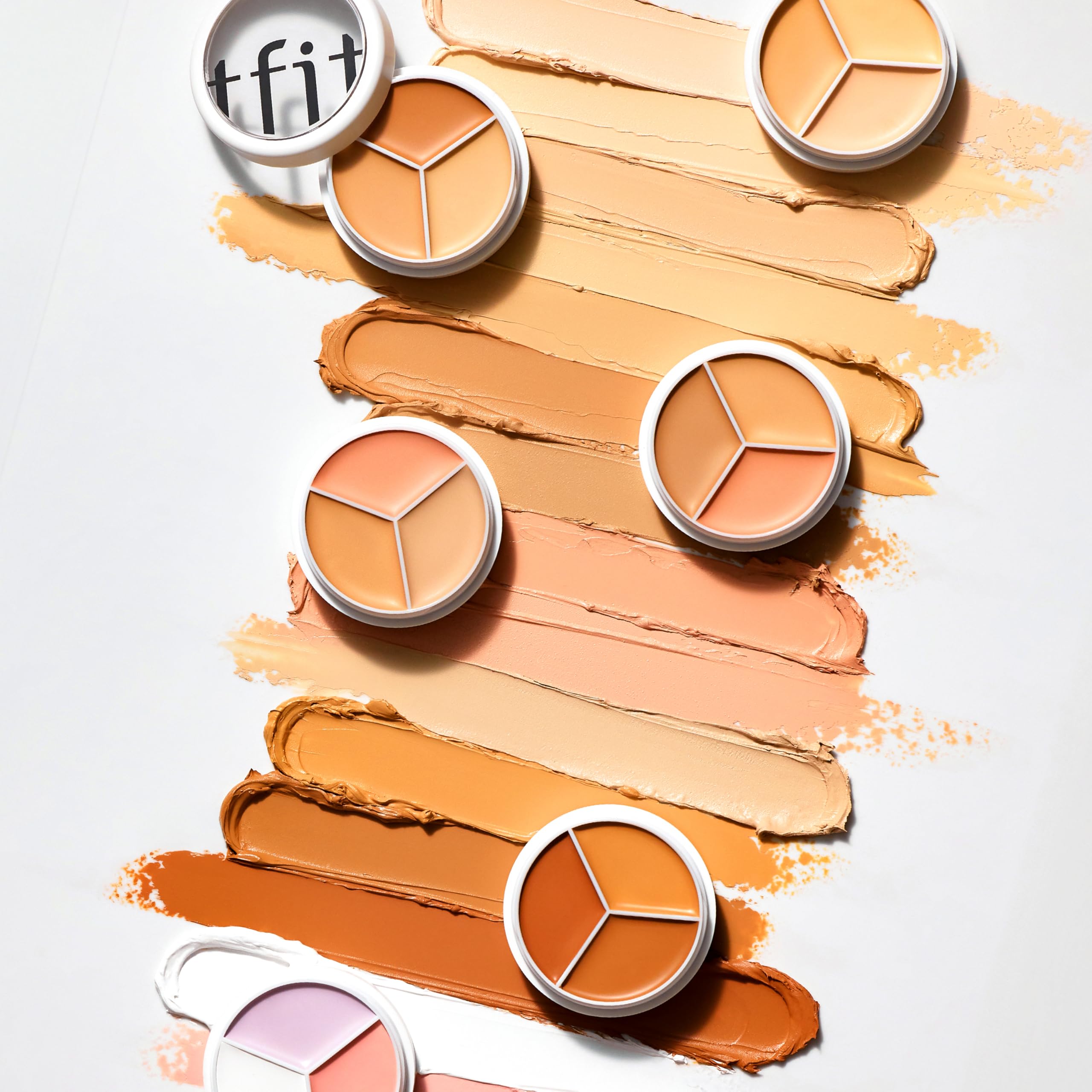 TFIT concealer 3-en-1: teintes variées pour corriger rougeurs et cernes.