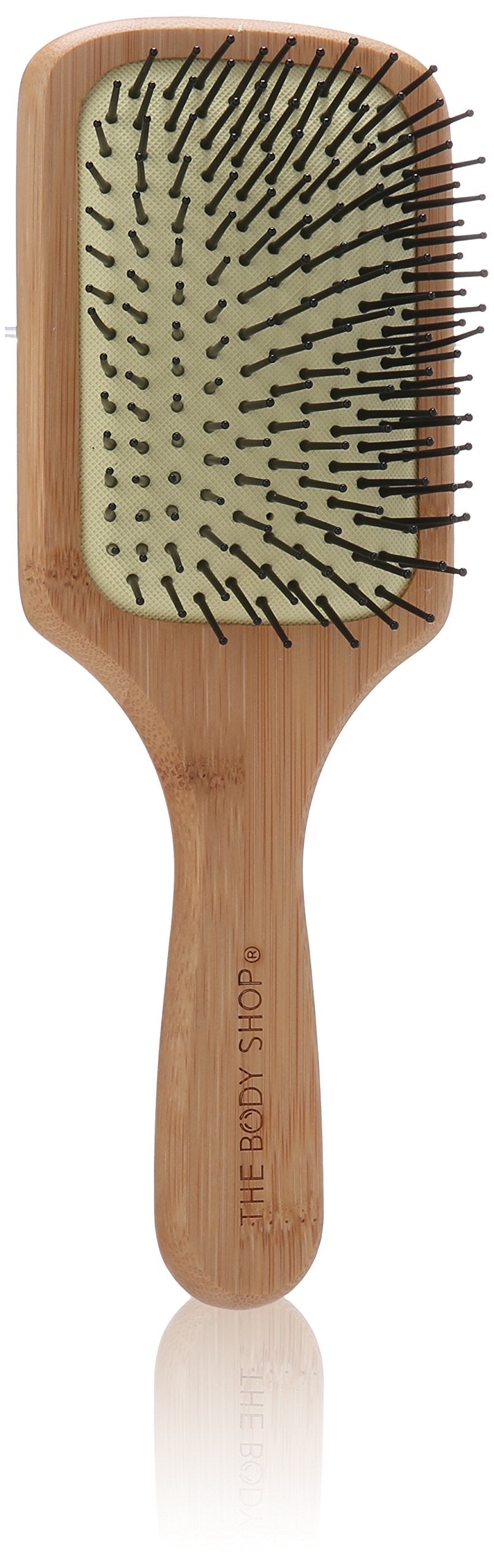 The Body Shop brosse cheveux bambou plat stimule cuir chevelu et démêle en douceur.