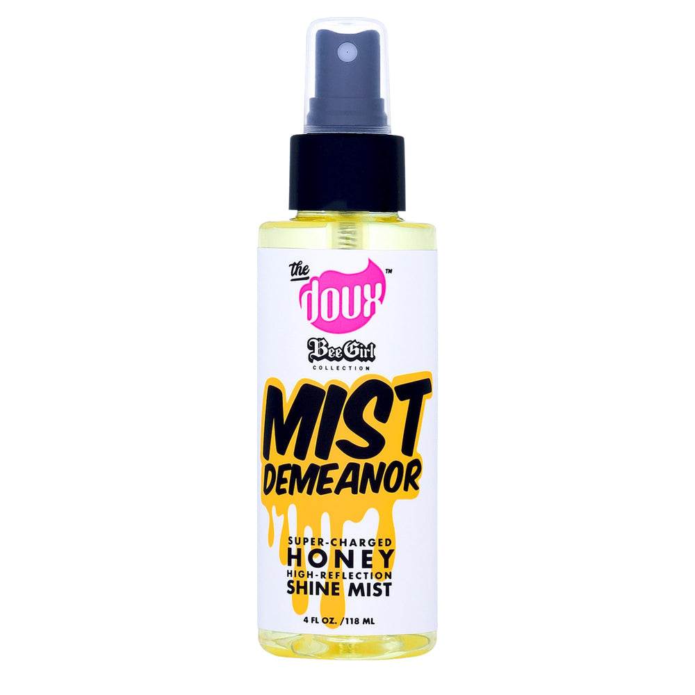 Le Doux Mist Demeanor flacon, promesse de brillance sans lourdeur sur les boucles.