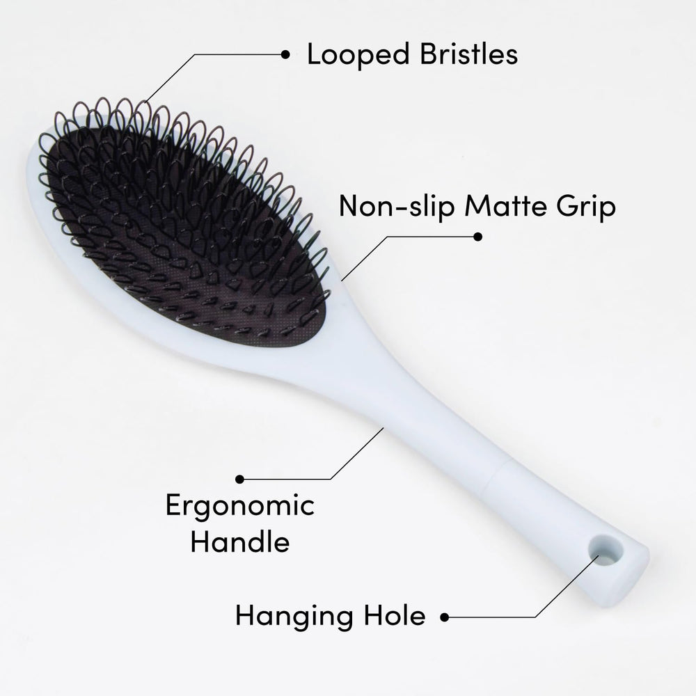 Brosse The Hair Shop ergonomique, manche confortable pour extensions et perruques.