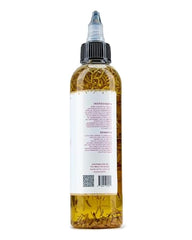 The Mane Attraction huile capillaire application massage cuir chevelu facilite le massage.
