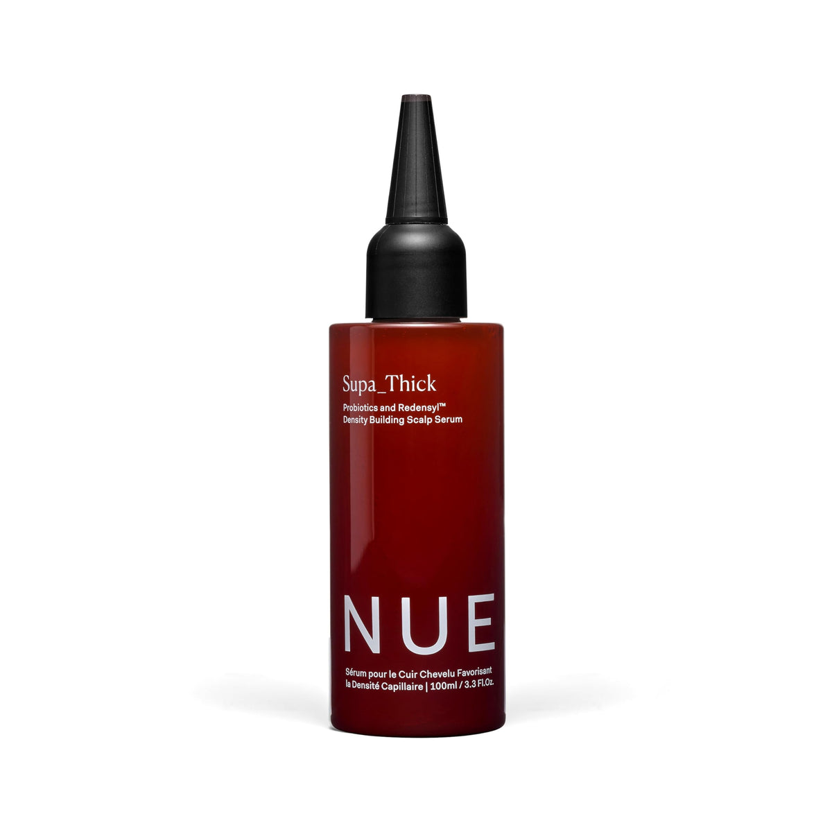Sérum The Nue Co. Supa Thick, flacon-applicateur pour une application précise sur le cuir chevelu.
