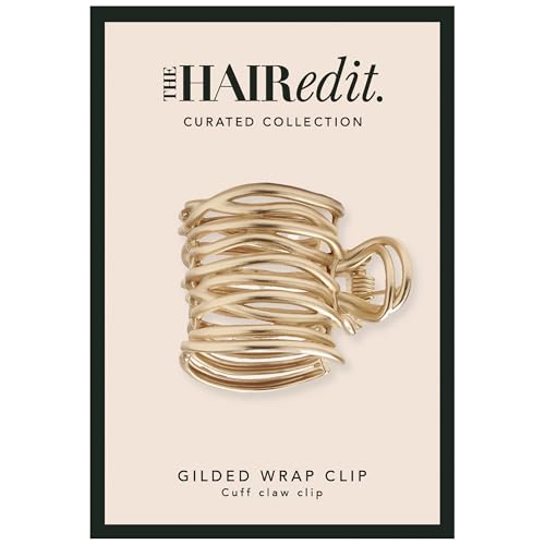 The Hair Edit pince-cuff doré enveloppant la queue de cheval, maintien sans effort.