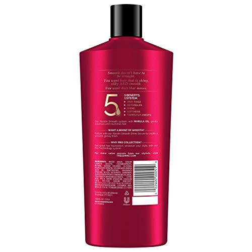 Keratin Smooth Shampoo lather spreading through hair for detangling ease.