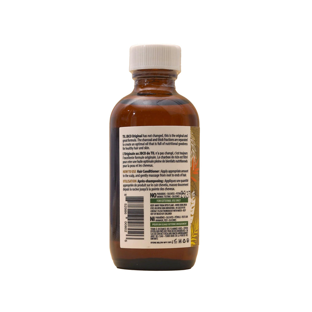 Maîtriser l’usage quotidien: huile ricin Tropic Isle Living sur cheveux secs.