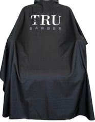 Cape de cou TRU BARBER en silicone pour salon — protège contre éclaboussures et cheveux.