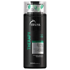 TRUSS Therapy: bouteille de shampooing anti-dandruff offrant cuir chevelu frais et propre.